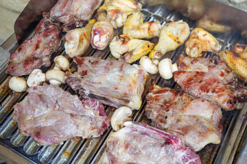 Chicken and pork meat on the barbecue