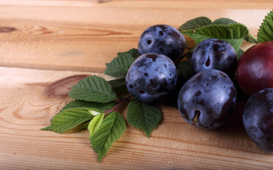 Plums on table