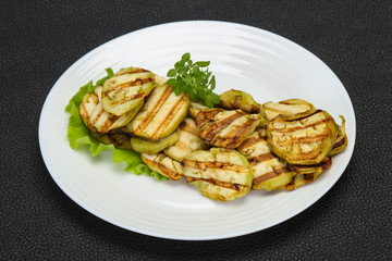 Grilled eggplant slices served basil