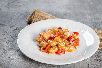 Sliced fried turkey with sesame garnished vegetables