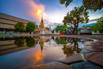 CHIANG MAI, THAILAND - APRIL 28, 2020 : Wat Suan Dok Temple reflection in twilight, is a Buddhist temple and Royal Temple of the Third Class in Chiang Mai Thailand. Landmark of Chiang mai.