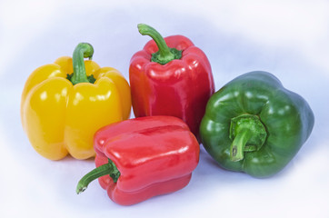 Beautiful sweet peppers on white background