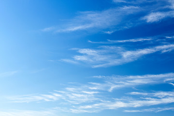 Fluffy white clouds flying on blue sky background