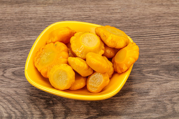 Marinated yellow patisson in the bowl