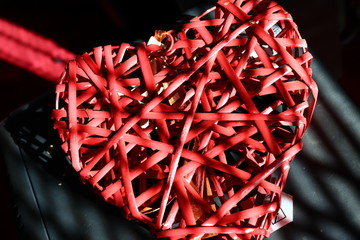 red heart on black background