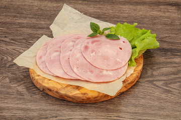 Slised ham snack over board