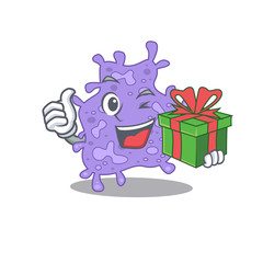 Smiling staphylococcus aureus cartoon character having a green gift box