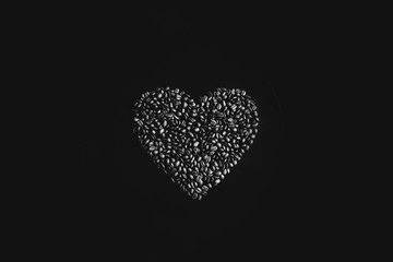 Brown coffee beans close up on black background