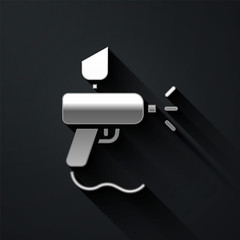Silver Paint spray gun icon isolated on black background. Long shadow style. Vector Illustration