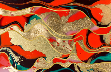 Red, black and gold paint liquid background. Abstract marble texture.