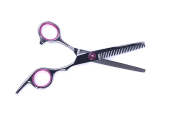 Open scissors with cloves on white background