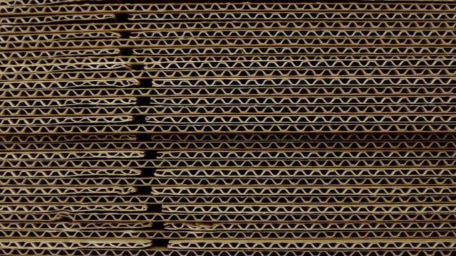 A stack of sheets of industrial packaging board. Cardboard Sheets for Boxes, copy space, industrial, carton, background