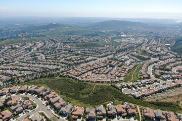 Aerial view of upper middle class neighborhood with big villas around Double Peak Park in San Marcos, California, USA.