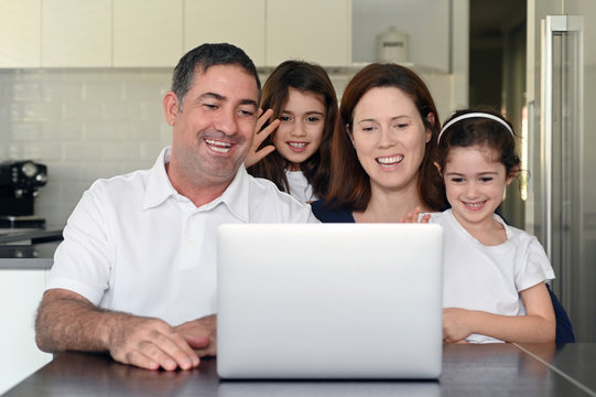 Family Keeping In Touch With Elderly Relatives Online