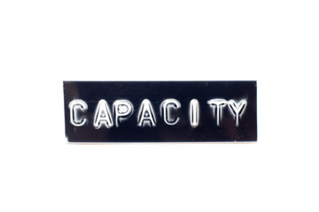 Embossed letter in word capacity in black banner on white background