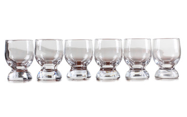 Glass jars with alcohol cocktails on white background