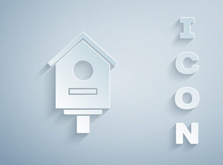 Paper cut Bird house icon isolated on grey background. Nesting box birdhouse, homemade building for birds. Paper art style. Vector Illustration
