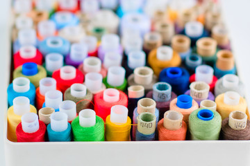 Accessories for sewing. Colored spools of thread