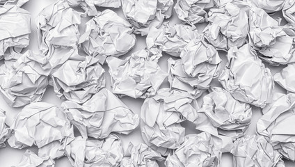 Many crumpled paper on ground,white and black background