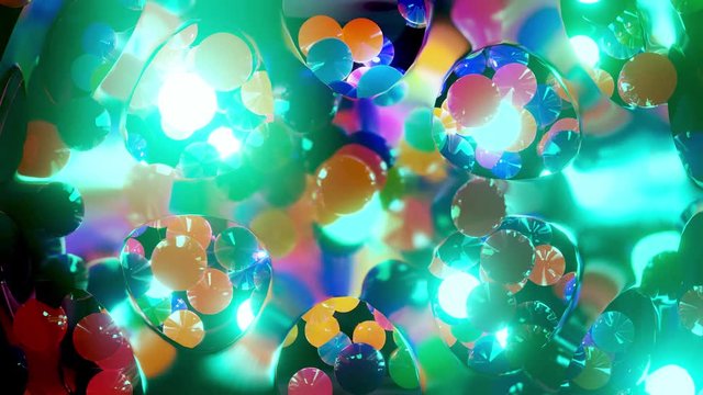 Abstract composition of colorful balls in air, which randomly light up and reflect in each other. Multicolored spheres in air as simple geometric dark background with light effects.