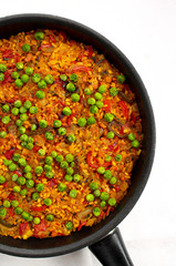 Vegan Paella with red peppers and green beans. 