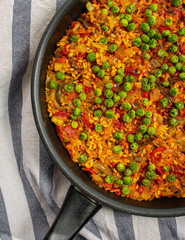 Vegan Paella with red peppers and green beans. 