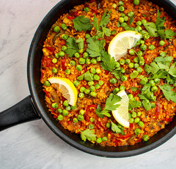 Vegan Paella with red peppers and green beans. 