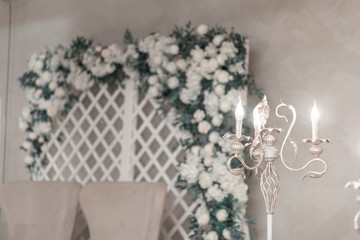 Decorations for a solemn wedding ceremony with beautiful lighting in the form of a retro candlestick