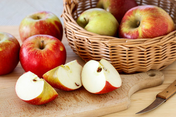Naklejka na ściany i meble Basket with apples on wooden table