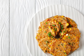 corn pancakes on a white plate, close-up
