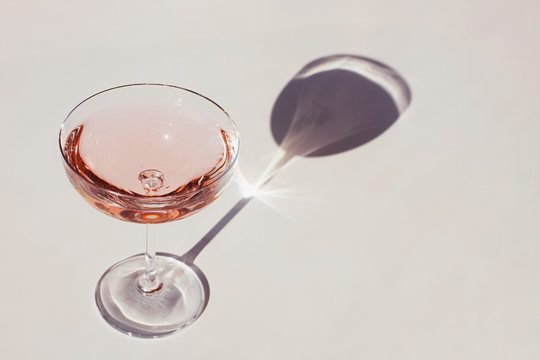 Glass of sparkling wine on the white table