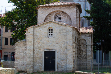 Fototapeta na wymiar Ancient ruins of the south chapel of the Basilica of St. Mary Formosa (also called Chapel of St. Mary Formosa) in the old town of Pula, in Croatia
