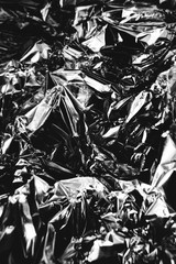 crumpled silver foil sheet, texture of shiny crumpled piece foil. Flat lay, copy space.