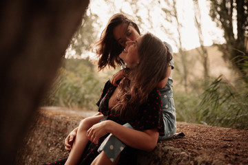 Two young women embraced on the field