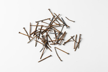 Rusty nails piling isolated on white background.