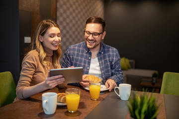 Couple shopping online at home