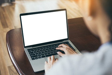 computer mockup image blank screen with white background for advertising,hand woman work using laptop contact business search information on desk at coffee shop.marketing and creative design