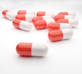 Capsule drug red and white color on white background. 3d render illustrations.