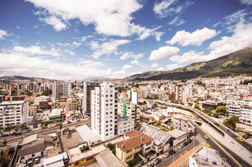 Fototapeta premium Beautiful view from modern part of Quito mixing new architecture with charming streets and green sourroundings, north part of the city of Quito