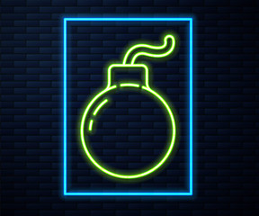 Glowing neon line Bomb ready to explode icon isolated on brick wall background. Vector Illustration