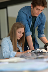 Fototapeta premium Students in photography working together on project