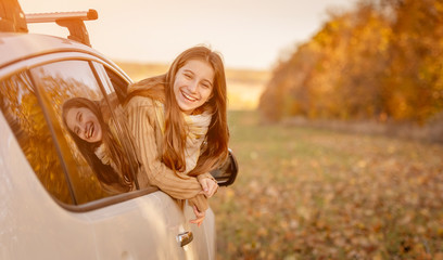 Girl peeking out car window