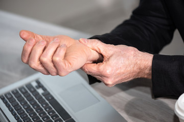 Man suffering from wrist pain