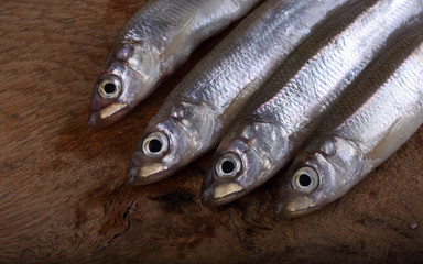 Smelt fish on cutting board