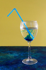 Blue cocktail on yellow blue background.