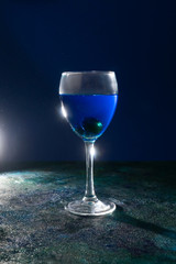 Blue cocktail on the black background.