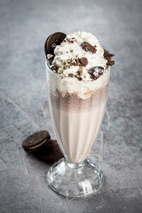Chocolate milkshake with chocolate chip cookies in a glass