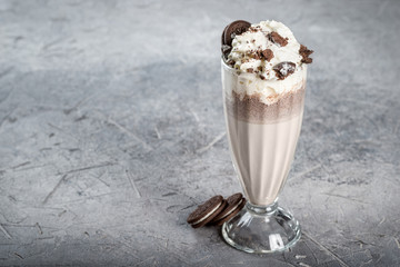 Chocolate milkshake with chocolate chip cookies in a glass