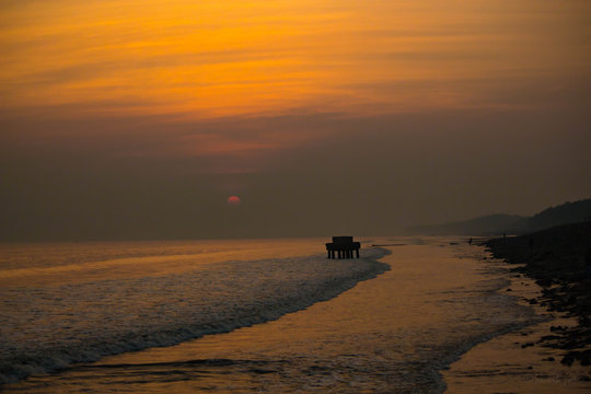 Beautiful sunset on indian sea beach at digha