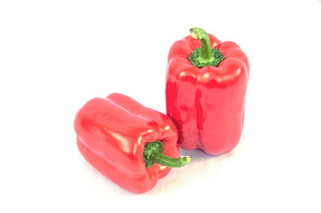 Big red sweet peppers on white background